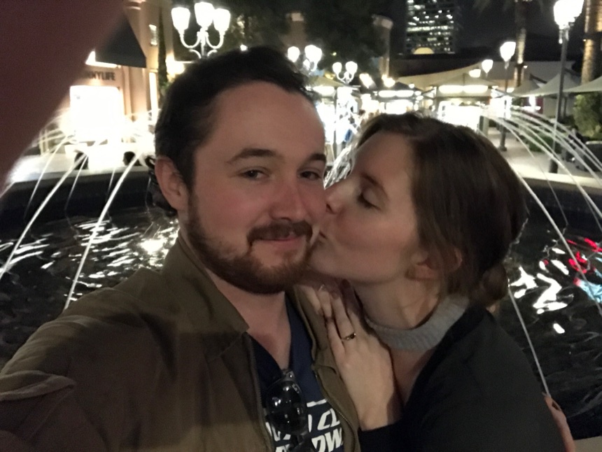 Kelsey and Matt by the fountain